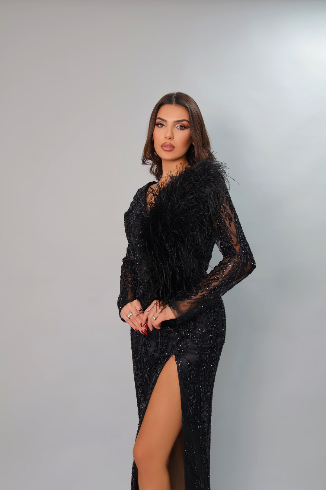 LONG SLEEVE BLACK EVENING GOWN WITH FEATHER DETAILS
